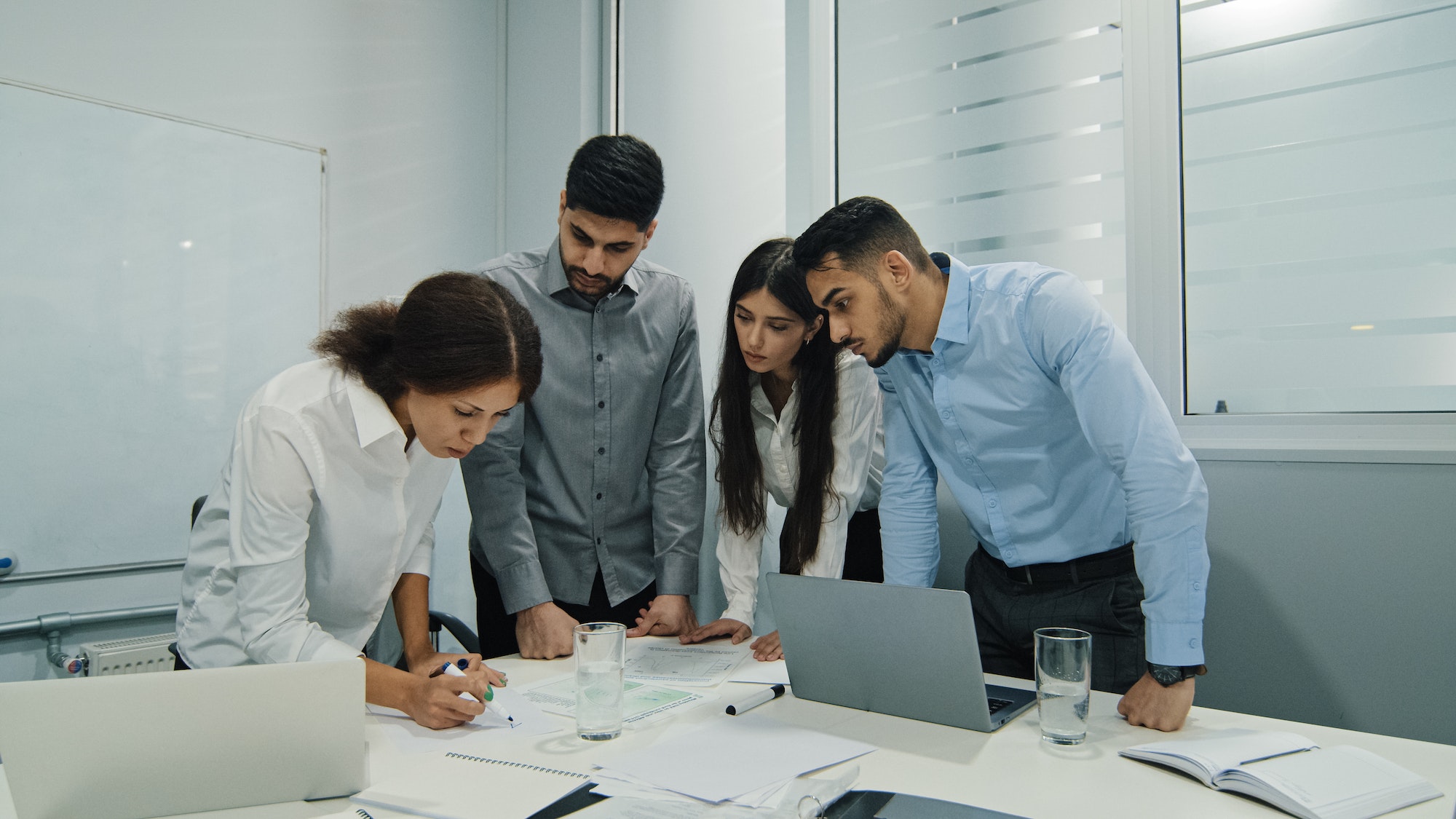 Woman team leader, successful employee mentor training diversity subordinates at corporate workshop